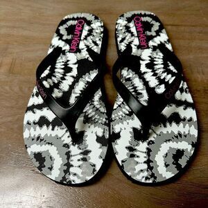 Calvin Klein black and white flip flops.